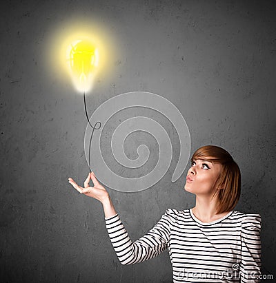 Woman holding a lightbulb balloon