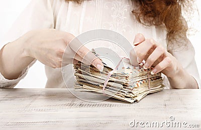 Woman holding package of vintage letters