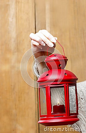 Woman holding red christmas lantern