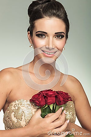 http://thumbs.dreamstime.com/x/woman-holding-red-rose-flowers-to-her-chest-laughs-beauty-young-camera-45813932.jpg