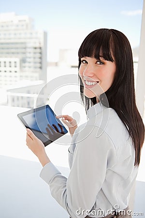 Woman holding a tablet pc in her hands