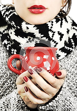 Woman with hot drink in winter