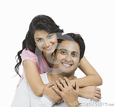 http://thumbs.dreamstime.com/x/woman-hugging-her-husband-behind-smiling-36256461.jpg