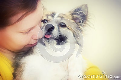 Woman hugging pet dog