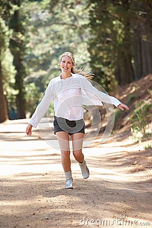 Woman Jogging Happily Along A Country Lane Royalty Free ...