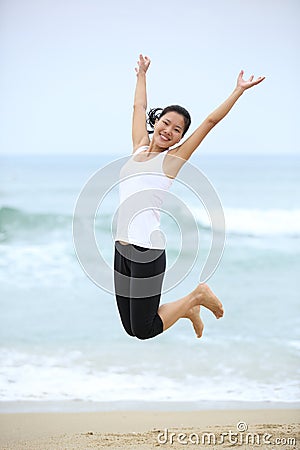 Woman jump on beach.