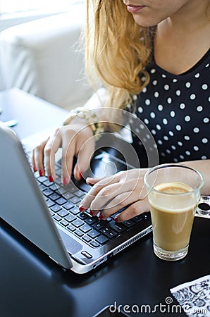 Woman with laptop and coffee