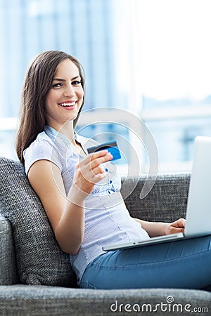 Woman with laptop and credit card