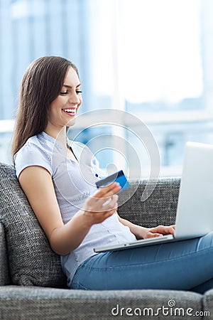 Woman with laptop and credit card