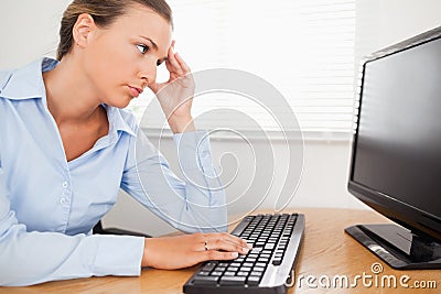 A woman looking to pc-screen in office