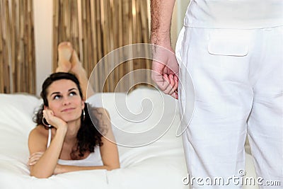 Woman lying looking up at a man