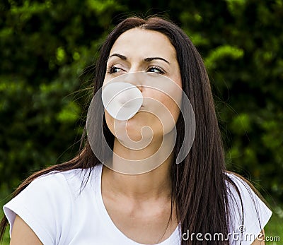 Woman making gum bubbles