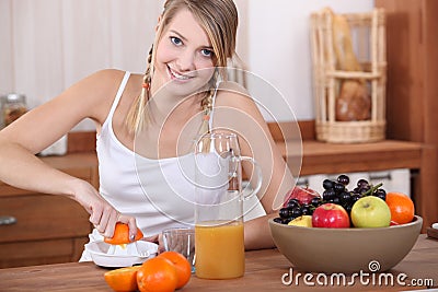 Woman making orange juice