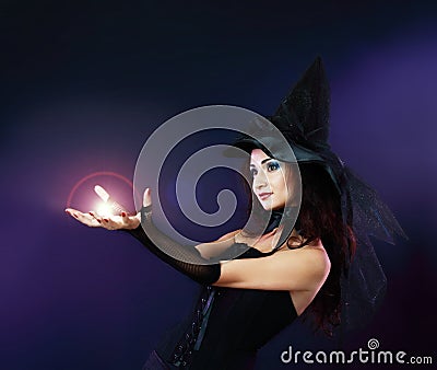 Woman making spell with magic fireball