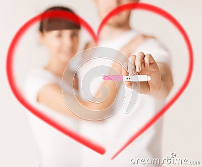 Woman and man hands with pregnancy test