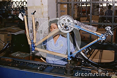 Woman on manufacturing assembly line