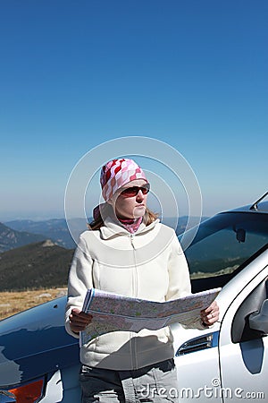 Woman with map on a road trip