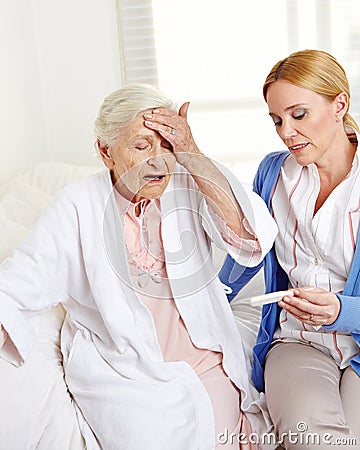 Woman measuring temperature at