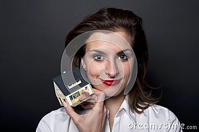 Woman with miniature house