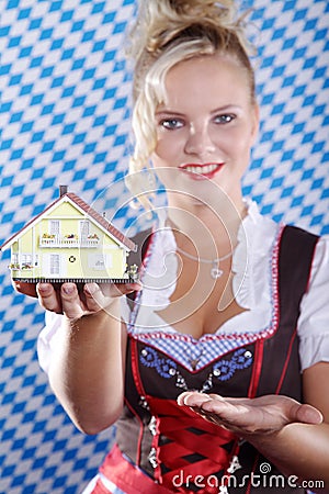 Woman with miniature house