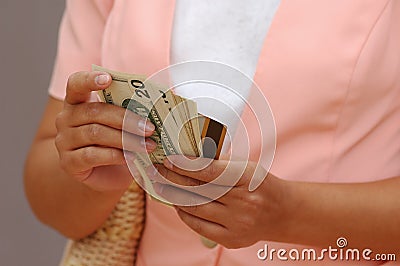 Woman With Money and a Credit Card