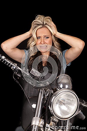 Woman motorcycle on black hands hair stress