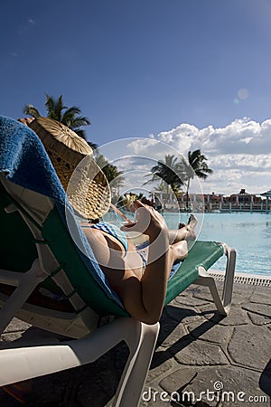 Woman near swimming pool in cuba