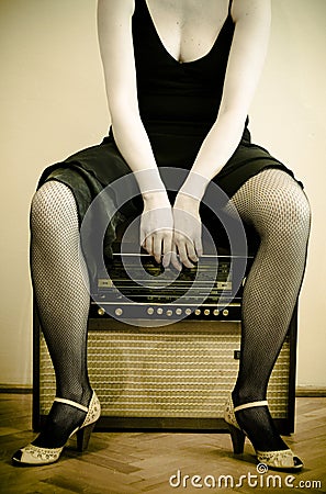 Woman and an old radio