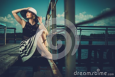 Woman on old wooden pier