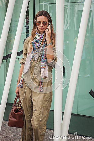 Woman outside Jil Sander fashion shows building for Milan Women s Fashion Week 2014