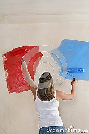 Woman Painting Wall Red And Blue With Paint Rollers