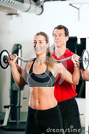 Woman with Personal Trainer in gym