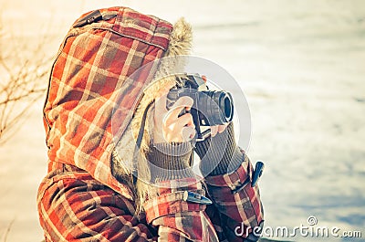 Woman photographer with retro photo camera outdoor