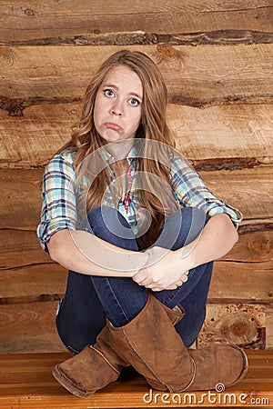 Woman plaid sad wood background