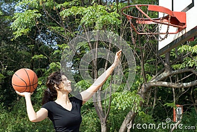 Woman Playing Basketball on Court - Horizontal