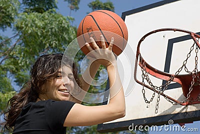 Woman Playing Basketball at Park - Horizontal