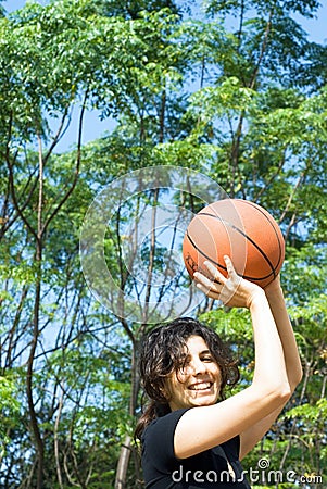 Woman Playing Basketball - Vertical