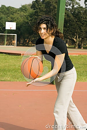 Woman Playing Basketball - Vertically framed ph