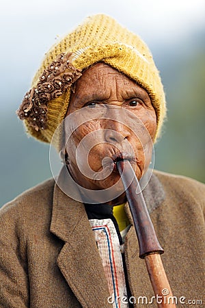 Woman playing Lusheng wind instrument