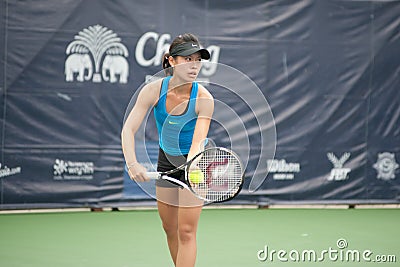 Woman playing tennis .