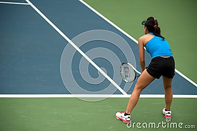 Woman playing tennis .