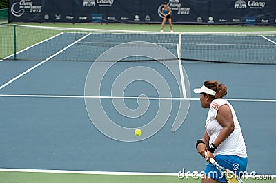 Woman playing tennis .