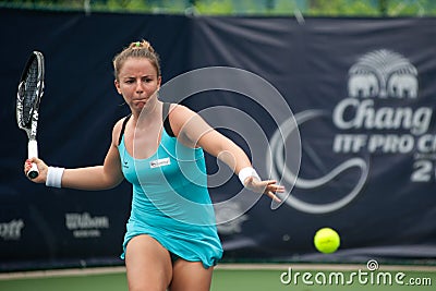 Woman playing tennis .