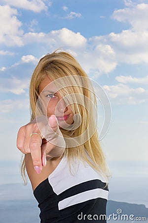 Woman pointing a finger at the camera