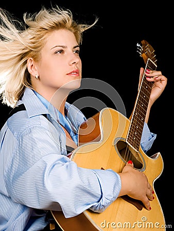 Woman posing with guitar