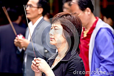 Woman in prayer in Taipei,Taiwan,May 24