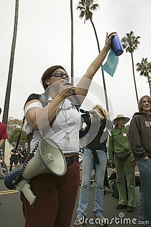 A woman protester with a loud speaker