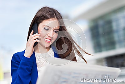 Woman reading a newspaper