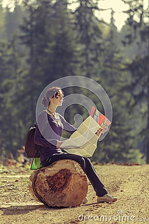 Woman reading travel map