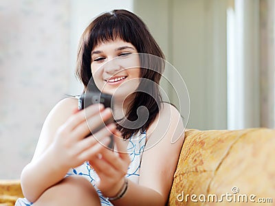 Woman reads SMS in mobile